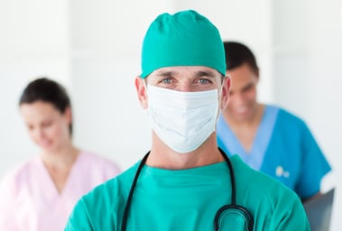Portrait of a surgeon wearing a surgical mask in a hospital